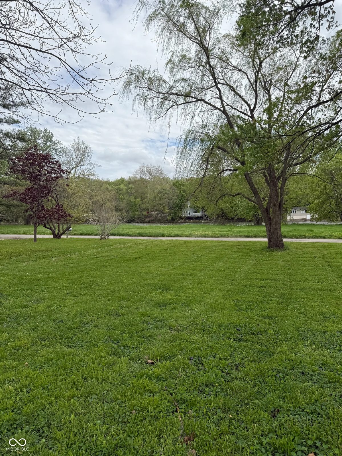 253 Riverwood Drive, photo 1: riverfront lot with mature trees